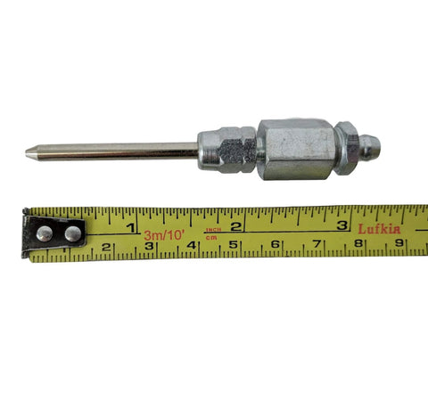 LockNLube narrow needle dispenser, silver metal with hex fittings, shown beside a measuring tape for scale.