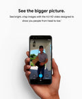 Hand holding smartphone showing person on screen via Wired Video Doorbell Cam With Always On Streaming HDR Video Night Vision And Two Way Talk For Your Front Door Real Time Person Alerts Easy Setup Works With Your Smart Home Devices Secure Home Monitoring.
