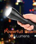 Hand holding Heavy Duty Aluminum 2D Cell Big Flashlight with High Lumens, single mode operation, powerful beam against night skyline