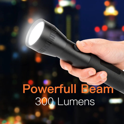 Hand holding Heavy Duty Aluminum 2D Cell Big Flashlight with High Lumens, single mode operation, powerful beam against night skyline