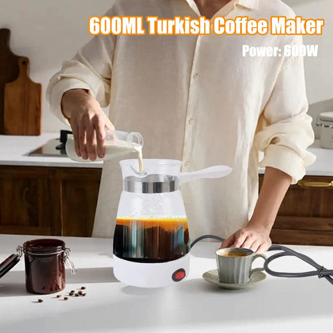 Person using 600 Ml Electric Turkish Coffee Maker For Home Use With Removable Anti Scald Handle, 600W Fast Brew Coffee Pot In Glass.