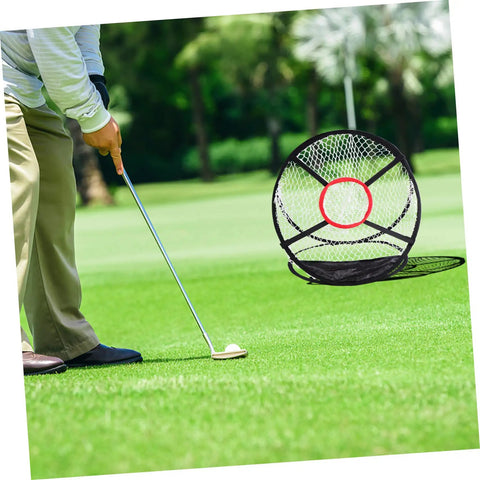 Man practicing on grass with Indoor Golf Practice Net For Home And Office Use Portable Swing Training Target Net Durable Foldable