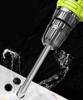 Front view of a green cordless drill with a 6mm carbide tile drill bit drilling into ceramic tile.