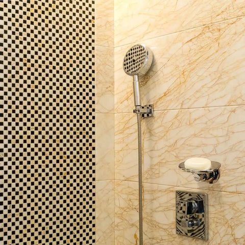 Elegant arc-design Powerful Suction Cup Soap Dish for Shower and Kitchen No Drill Mount Holds Up to 7.5 Pounds next to showerhead.