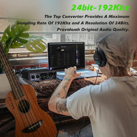Person using USB Audio Interface With 32 Bit 192 kHz Resolution XLR Mic And Line Inputs Phantom Power Direct Monitoring And Loopback