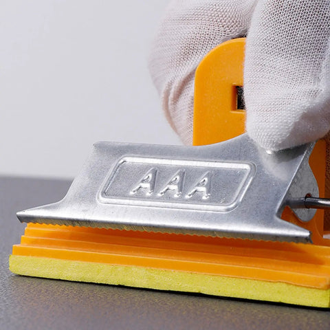 Close-up of a durable hand sander block with strong bite spring, showcasing clamp details for two pack sandpaper holder with sponge grip.