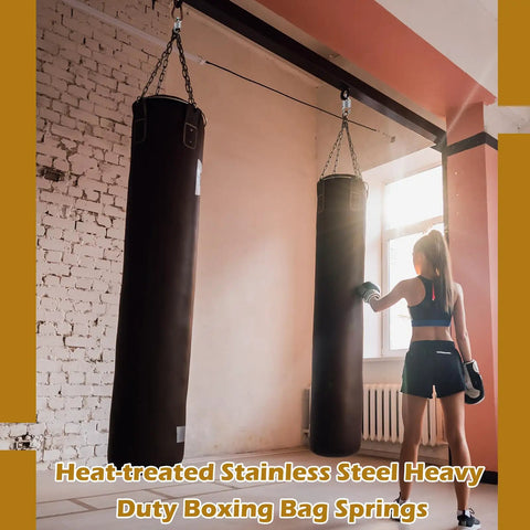 Woman training with hanging boxing bag suspended by Six Pack Heavy Duty Swing Springs, 3000 Lbs Capacity for gym use.