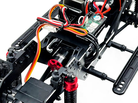 Built Different 1/18 Scale Brushless Rc Truck Crawler Rtr showing detailed wiring and motor setup with steel core gears.