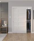 Richelieu Hardware 14660BC 60 Inch Bypass Door Hardware Kit in use with white sliding closet doors installed in bedroom