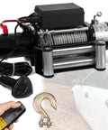 Heavy Duty 4500 Lbs Electric Winch Kit For Trucks And Jeeps with steel cable, wireless remote, and hook for off-road recovery.