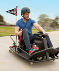Person riding Crazy Cart XL Drifting Ride On Toy With High Torque Chain Driven Motor, Powder Coated Steel Frame, Extreme Drifts.
