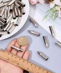 50 Pack Stainless Steel 7mm Arrow Tips Field Points Glue On For Arrows with ruler and coin for size comparison