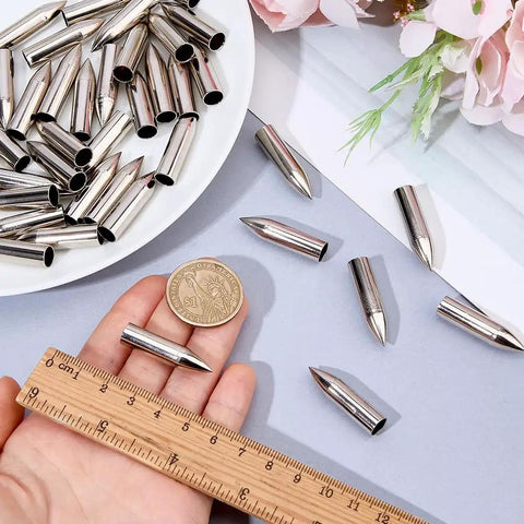50 Pack Stainless Steel 7mm Arrow Tips Field Points Glue On For Arrows with ruler and coin for size comparison