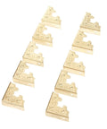 10 Pcs Badass Gold Metal Embossed Corner Protectors Covers For Photo Frames And Craft Boxes Premium Iron Heavy Duty Guards Smooth Finish Sturdy Mini Size Protection Kit displayed in a row.