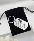 Engineer Definition Keychain Gift For Men And Women shown with engraved stainless steel tag and black velvet pouch.