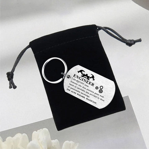 Engineer Definition Keychain Gift For Men And Women shown with engraved stainless steel tag and black velvet pouch.