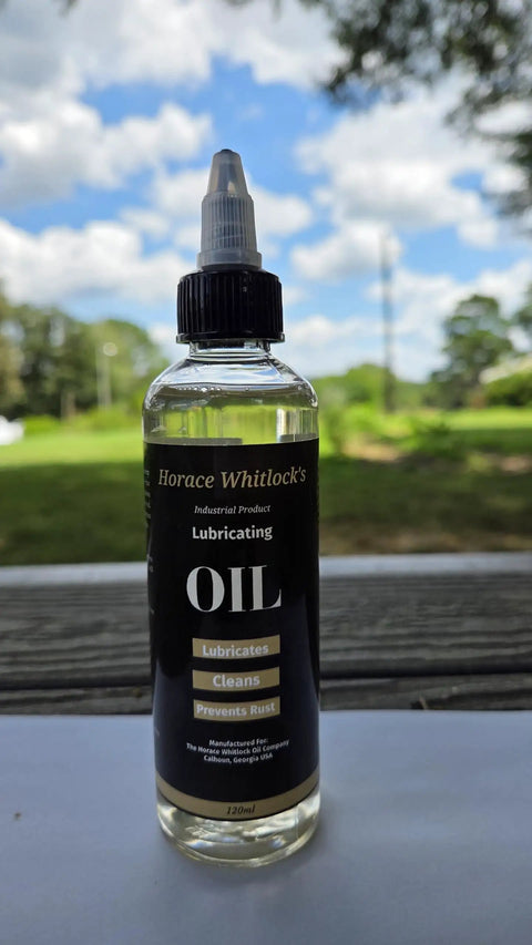 120 ml bottle of Rugged Industrial Lubricating Oil For Tools And Machinery With Rust Prevention displayed outdoors