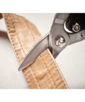 Heavy Duty Aviation Tin Snips Straight Cut 9 7/8 Inch cutting fabric, close-up of serrated chrome molybdenum blades
