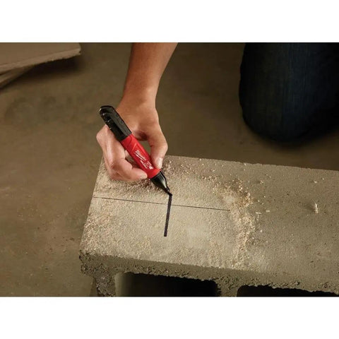 Person using Inkzall Chisel Tip Multi Surface Jobsite Marker That Writes Through Dusty, Wet, and Oily Surfaces With Water, Oil, and Dust Resistance Tough As Nails Durable Marker Tip for Concrete OSB and Rough Surfaces 2 Pack on a dusty concrete block