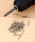 M2 Flat Head Self Tapping Screws Assortment Kit Featuring Nickel Plated Carbon Steel Build and driver on wood surface.