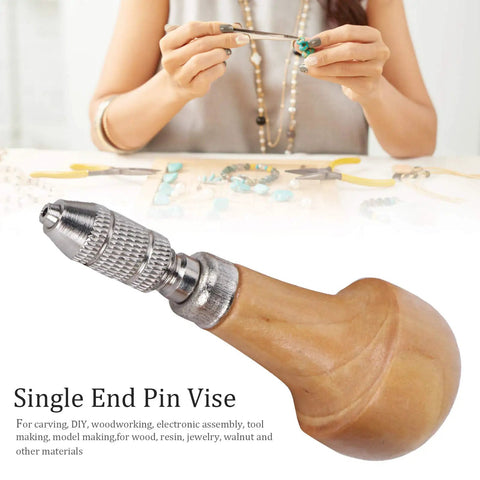 Single End Pin Vise with solid wood handle for precise jewelry making and crafting repairs in use.