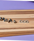 Tough As Nails Stainless Steel Spring Lock Washers M10 Split Ring Kit 100 Pieces on wood surface with screws.