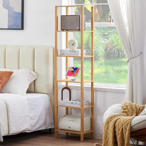 Five Tier Tall Narrow Bookshelf Takes Up Zero Floor Space While Holding All Your Favorites In A Smooth Natural Finish fits against a wall in a bedroom.