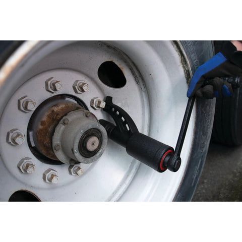 Model M208 3,688 Ft-Lbs Torque Multiplier Wrench with 1-Inch Drive in action loosening lug nuts on a truck wheel