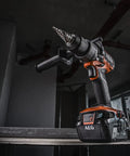 Heavy Duty 18V Cordless Impact Drill Packs Killer 110Nm Torque And Dual Speed Gears With Two Rugged 4.0Ah Batteries Plus Bright Led Work Light, angled view on a shelf.