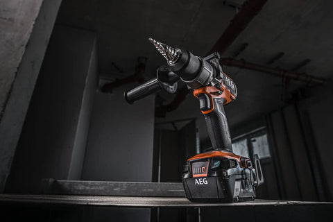 Heavy Duty 18V Cordless Impact Drill Packs Killer 110Nm Torque And Dual Speed Gears With Two Rugged 4.0Ah Batteries Plus Bright Led Work Light, angled view on a shelf.