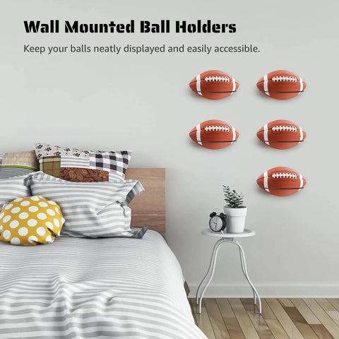 Five Pack Wall Mount Ball Holders Rugby Style Rack For Football Soccer Basketball Keeps Your Garage Neat And Gym Ready Includes 26 Screws And Expansion Anchors For Quick Secure Mounting. Wall-mounted rugby-style ball holders on a bedroom wall, 5-pack steel rack.