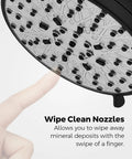Close-up of Jaida Tub And Shower Trim Kit With Restore Technology showerhead with wipe clean nozzles being wiped by a finger.