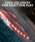 High Speed RC Boat With LED Hull Lights For Adults Up To 20 MPH Remote Control Boat 2.4GHz With Two Rechargeable Batteries For Pools And Lakes Red Gift Idea depicted on water with glowing LED lights at night.