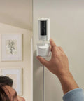 Man installing the Sleek 360 Degree Pan Tilt Indoor Security Camera With Crisp Hd Video And Two Way Talk on a wall.