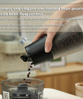 Smart Vacuum Coffee Bean Storage Container With Digital Temperature And Humidity Display Tracks Freshness pouring coffee beans.
