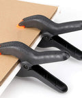Six Pack 9 Inch Hefty Spring Clamps Made From Tough Nylon With Cushioned Jaw Tips engineered for knockout grip on cardboard.