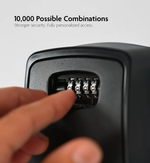 Close-up of fingers setting 4-digit combination on XXL Wall Mount Key Lock Box Outdoor Key Safe Waterproof Heavy Duty Metal Body