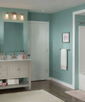 Modern bathroom with Eva 3 Light Brushed Nickel Vanity Light With Frosted Glass Dual Mount Bath Fixture above mirrors.