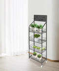 Heavy Duty 4 Tier Wire Shelving Storage Rack With Tough As Nails Metal Shelves And Raised Edge Baffles with plants.