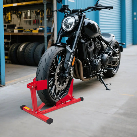 Heavy Duty Motorcycle Wheel Chock And Front Tire Stand For 17 To 21 Inch Rigs Adjustable 1500 Lb Capacity Red Steel Trailer Stand For Easy Bike Parking And Safer Rides securing a motorcycle front tire in a garage setting