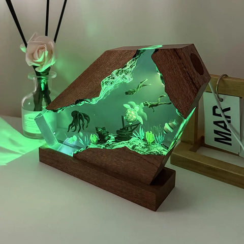 Cool Octopus Resin Lamp With Wooden Base Handcrafted Ocean Night Light RGB Color Changing Ambient Lamp For Bedroom Decor Scuba Diving Gift For Him Or Her Unique Birthday And Holiday Gift showing glowing underwater scene on table.