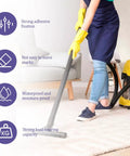Person cleaning rug with vacuum, showcasing 16 Piece Gripper Set For Rug Non Slip Rug Pads For Hardwood Floors Reusable Rug Anti Slip Grips