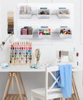 Six Pack Slatwall Bins With Hooks Set For Wall Mounted Storage Handy Organizer Containers in a craft room with supplies