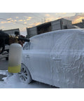 Person using 1.1mm Foam Cannon Orifice Nozzle 2 Pack With Universal Thread Fits Snow Foam Lance Replacement Tip For Thick Rich Foam And Quick Easy Restore Your Foam Cannon on car