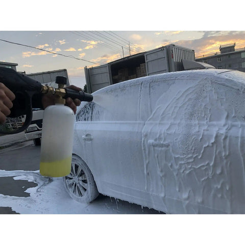 Person using 1.1mm Foam Cannon Orifice Nozzle 2 Pack With Universal Thread Fits Snow Foam Lance Replacement Tip For Thick Rich Foam And Quick Easy Restore Your Foam Cannon on car