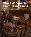 Man working at desk with Hi Res Audio 2.0 Studio Monitors For Your Home Studio Setup Vibe, 110W RMS, 3 Way Active Bookshelf Speakers