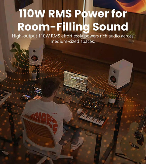 Man working at desk with Hi Res Audio 2.0 Studio Monitors For Your Home Studio Setup Vibe, 110W RMS, 3 Way Active Bookshelf Speakers