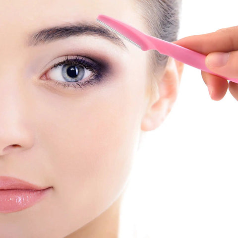 Close-up of woman using 24 Pack Eyebrow Razors With Precision Covers For Safe Facial Hair Removal And Neat Trimming.