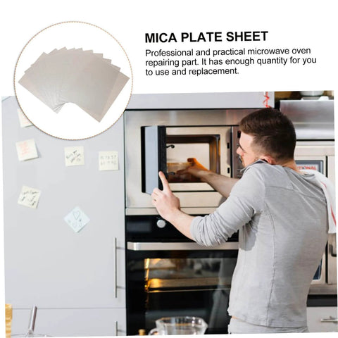 Person demonstrating how to install Pro Grade Mica Waveguide Cover For Microwave Ovens, Heat Resistant Insulation Plate, 12 Piece Set