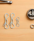 Locking Bow Tie Cotter Pins Two Sets Heavy Duty Spring Fasteners Kit on wood surface with bolts and screws